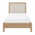Cama individual de madera y tapizado en beige